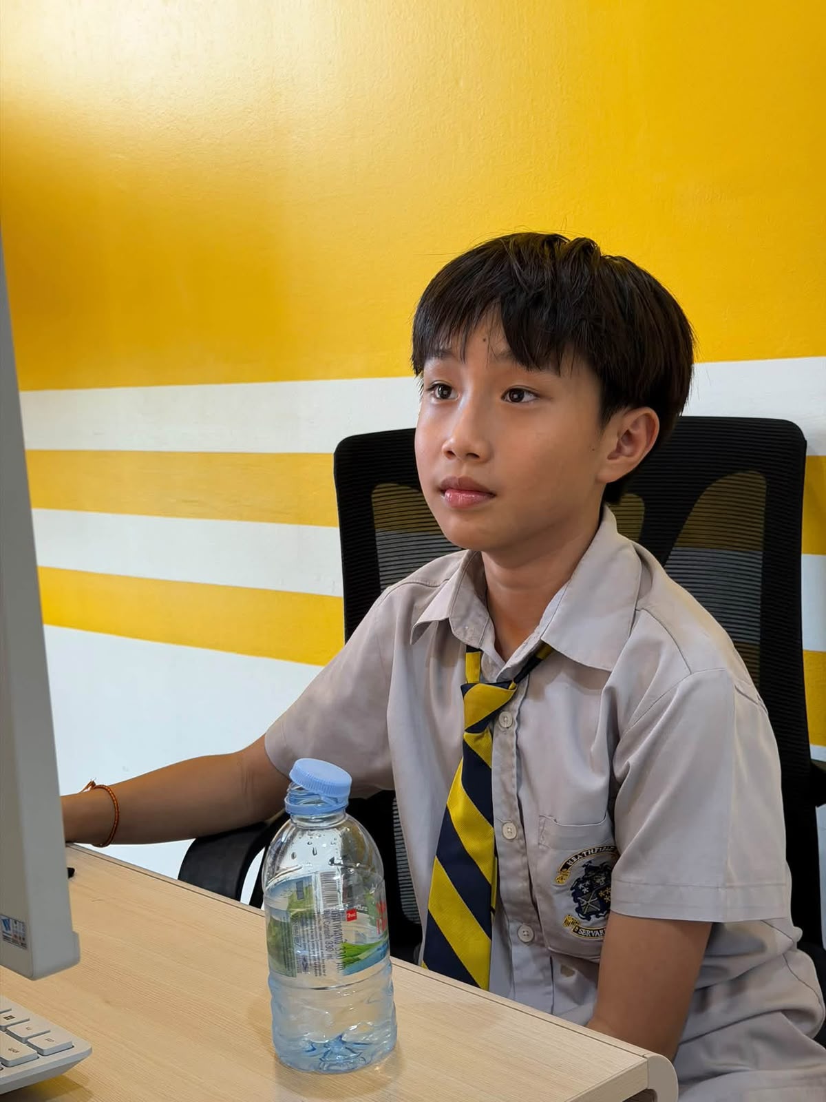 Student learning at a computer in the Algorithmics classroom